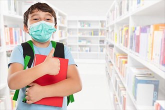 Young Pupil Child Boy With Mask Against Corona Virus Corona Virus In School Showing Thumbs Up With Text Free Space Copyspace in Stuttgart