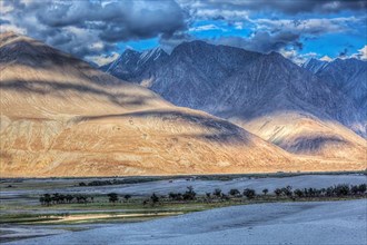 High dynamic range image valley in Himalayas. with sand dunes. Hunder