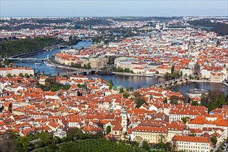Aerial view of Charles Bridge over Vltava river and Old city from Petrin hill Observation Tower. Prague