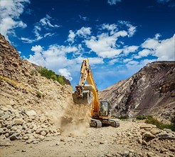 Excavator doing road construction in Himalayas. Ladakh