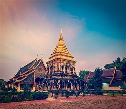 Vintage retro effect filtered hipster style travel image of Buddhist temple Wat Chedi Luang in twilight. Chiang Mai