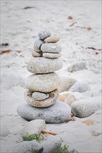 Stone cairn tower. Pile of pebble stones. Concept of harmony and balance