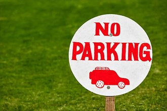 No parking sign on green lawn