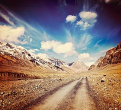 Vintage retro effect filtered hipster style travel image of Road in mountains Himalayas. Spiti Valley