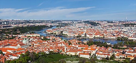 Aerial view of Charles Bridge over Vltava river and Old city from Petrin hill Observation Tower. Prague