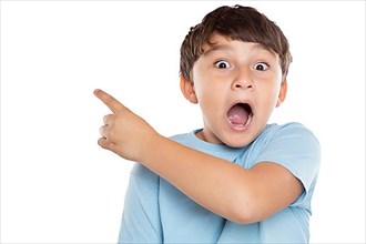 Child boy is amazed surprised points to advertising success isolated exempted in Stuttgart