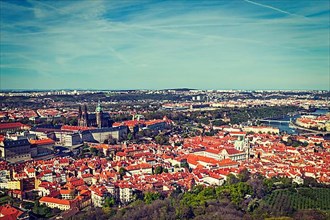 Vintage retro hipster style travel image of aerial view of Hradchany part of Prague the Saint Vitus St. Vitt's Cathedral and Prague Castle