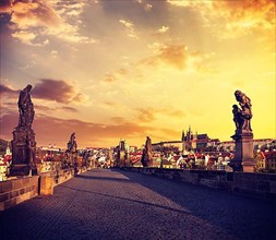 Vintage retro effect filtered hipster style travel image of Charles bridge and Prague castle in the early morning on surise. Prague