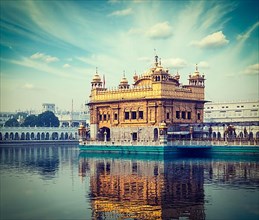 Vintage retro hipster style travel image of Sikh gurdwara Golden Temple