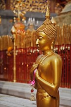 Standing Buddha statue in Wat Phra That Doi Suthep