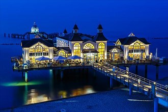 Pier in the Baltic seaside resort Sellin on the island of Ruegen on the Baltic Sea at night in Sellin