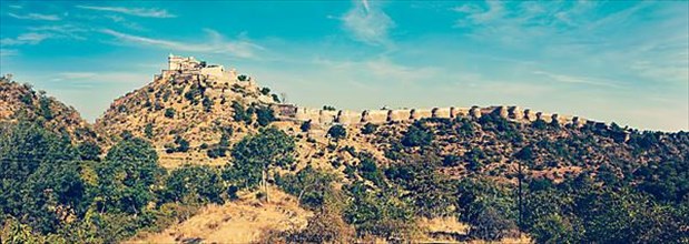 Vintage retro hipster style travel image of panorama of Kumbhalgrh fort. Rajasthan