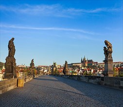 Charles bridge and Prague castle in the early morning. Prague