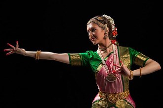 Young beautiful woman dancer exponent of Indian classical dance Bharatanatyam