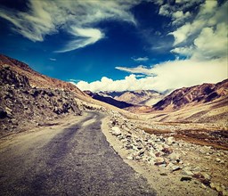Vintage retro effect filtered hipster style travel image of Scenic road in Himalayas near Khardung-La pass. Ladakh