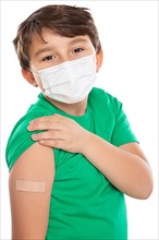 Child boy with plaster at children vaccination in school mask against coronavirus corona virus text free space copyspace in Stuttgart