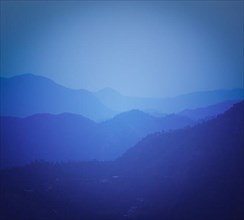 Vintage retro effect filtered hipster style travel image of mountains Himalayas after sunset. With copyspace. Shimla