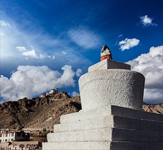 Whitewashed chorten and Tsemo fort and gompa. Leh