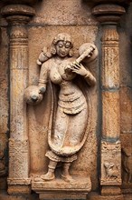 Musician playing veena. Bas reliefes in Hindu temple. Sri Ranganathaswamy Temple. Tiruchirappalli