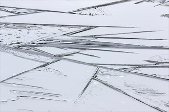 Creative photo. Patterns on a frozen lake