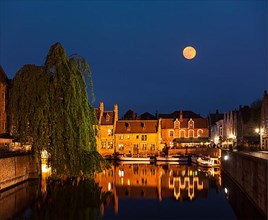 Canal and medieval houses in twilight. Bruges