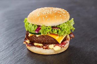 Hamburger cheeseburger fast food meal on slate in Stuttgart