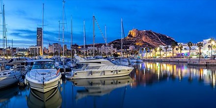 Port of Alicante at night Port dAlacant Marina with boats and view of Castillo Castle holiday travel city panorama in Alicante