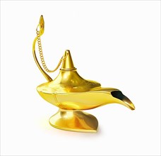 Golden Aladdin magic genie lamp isolated on white