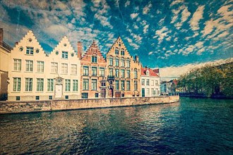 Vintage retro hipster style travel image of Bruges canals. Brugge