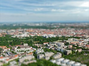 Aerial view of Munich from Olympiaturm Olympic Tower with tilt shift toy effect shallow depth of field. Munich