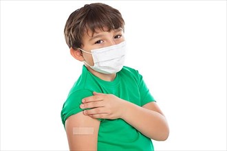 Child boy with plaster at children vaccination mask against coronavirus corona virus isolated exempt in Stuttgart