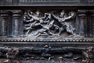Bas relief depicting Durga slaying demon