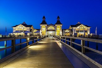 Pier in the Baltic seaside resort Sellin on the island of Ruegen on the Baltic Sea at night in Sellin