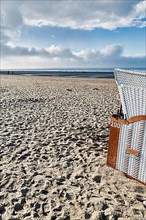 Beach chair on empty sandy beach