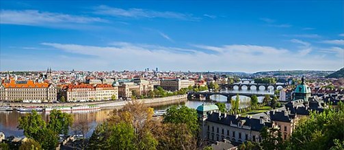 Vintage retro hipster style travel image of panoramic view of bridges over Vltava river from Letna Park. Prague