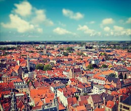 Vintage retro hipster style travel image of aerial view of Bruges