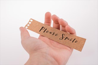 Please smile text on paper on a white background