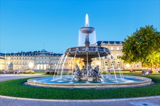 Schlossplatz with fountain and New Palace travelling blue hour in Stuttgart