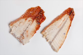 Two pieces of smoked eel