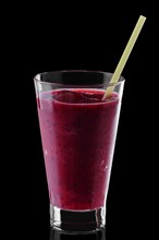 Glass of raspberry smoothie isolated on black background