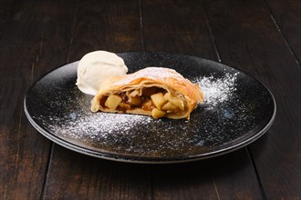 Piece of classic apple strudel on a plate