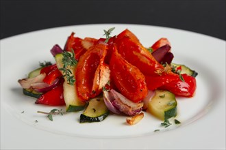 Grilled vegetables on white plate cutted on slices
