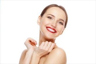 Happy beautiful girl with her hands near chin with a laugh looking to the side. Teeth and skin care