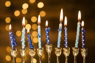 Small candles menorah near abstract lights. Resolution and high quality beautiful photo