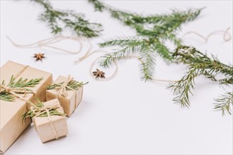 Wrapped christmas gifts near coniferous twigs. Resolution and high quality beautiful photo