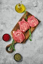 Top view of raw lamb neck meat on cutting board