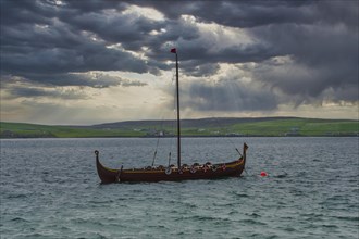 Old viking boat before the seafront of Lerwick