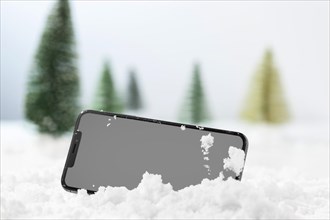 Close up view of smartphone in snow