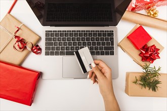 Woman buying christmas presents online with gifts table. Resolution and high quality beautiful photo