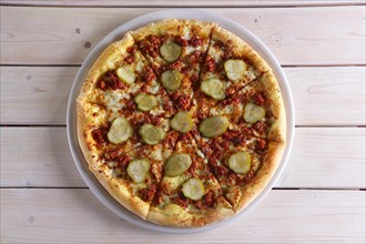 Double cheese pizza with pickled cucumber
